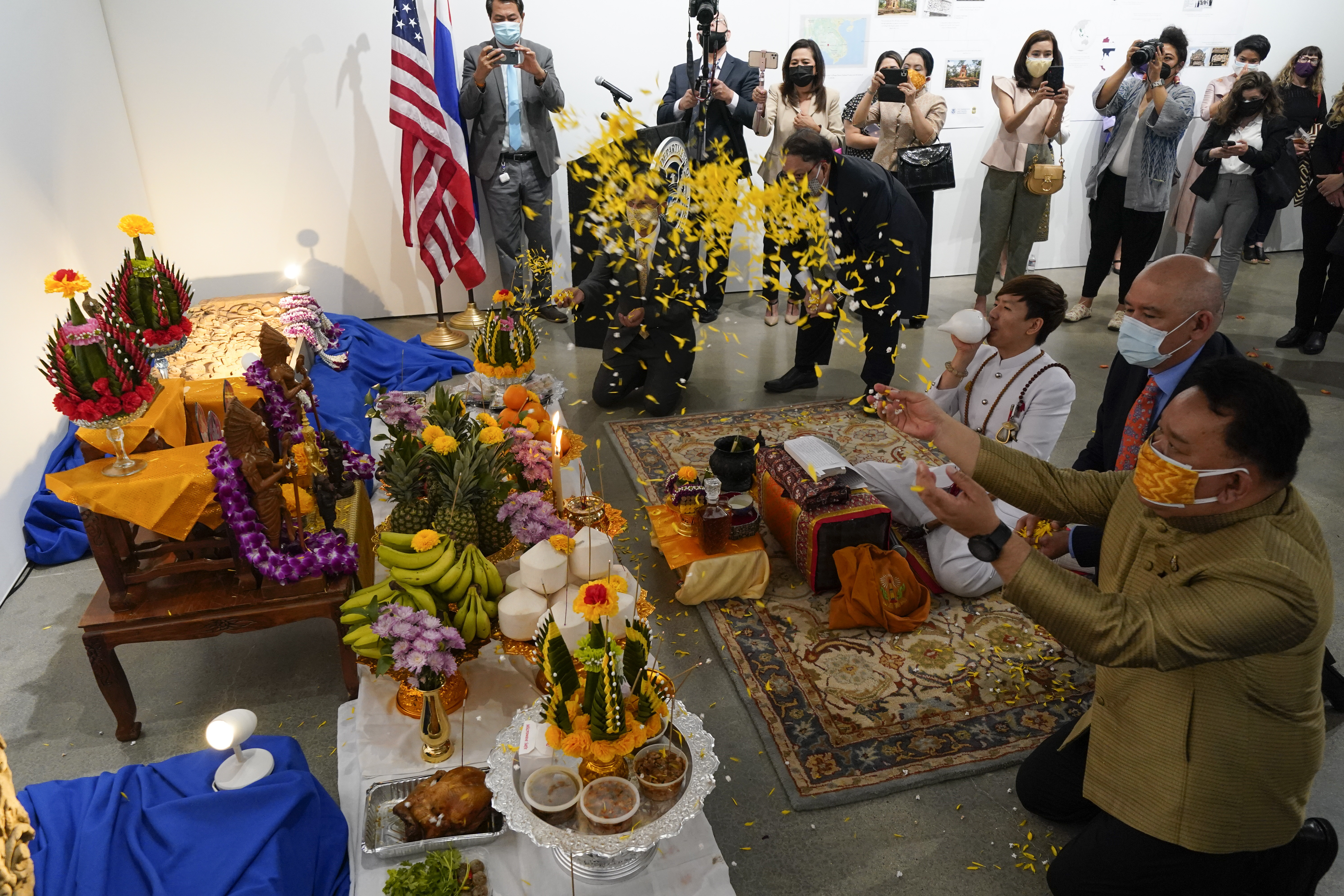 Thai and U.S. officials participate in a ceremony in Los Angeles on May 25, 2021, to return two stolen hand-carved sandstone lintels dating back to the 9th and 10th centuries to the Thai government. The 1,500-pound antiquities had been stolen and exported from Thailand ??