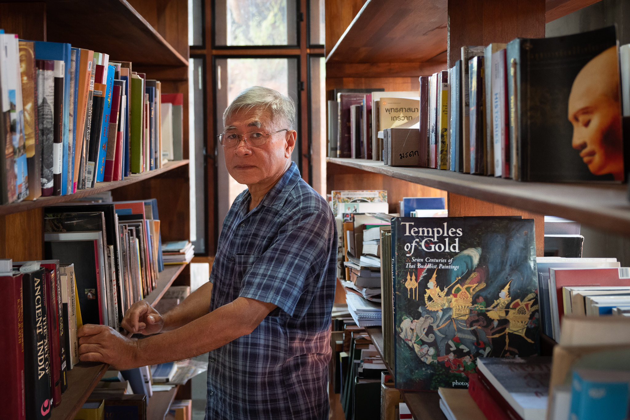 Tanongsak Hanwong, an archaeologist and member of Thailand's committee on repatriation of stolen artifacts, is pictured at his home in Pak Chong, Thailand, on Nov. 4, 2022. (Photo by Athikhom Saengchai/Special to The Denver Post)