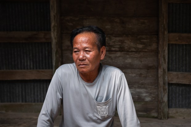 Soin Chansri, pictured in Buriram Province, Thailand, on Nov. 5, 2022, recalled bringing food to his father while he dug for artifacts at the Plai Bat II temple. Art collector Douglas Latchford paid villagers for artifacts taken from the temple. (Photo by Athikhom Saengchai/Special to The Denver Post)