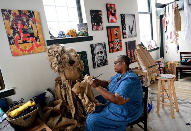 Chloé Duplessis works in her studio at East Street School in Trinidad on a burlap dress for her upcoming show Sista Soldier on September 11, 2023. The immersive exhibit will be a celebration and recognition of Cathay Williams, the only known female Buffalo Soldier, and the first African American female to serve in the United States Army, who spent her final years in Trinidad. (Photo by Helen H. Richardson/The Denver Post)