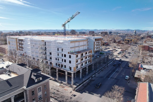 The construction site for a 7-story apartment building at 1110 E. Colfax Ave. that will bring 334 apartments to East Colfax in Denver is pictured on Tuesday, Dec. 5, 2023. (Photo by Hyoung Chang/The Denver Post)