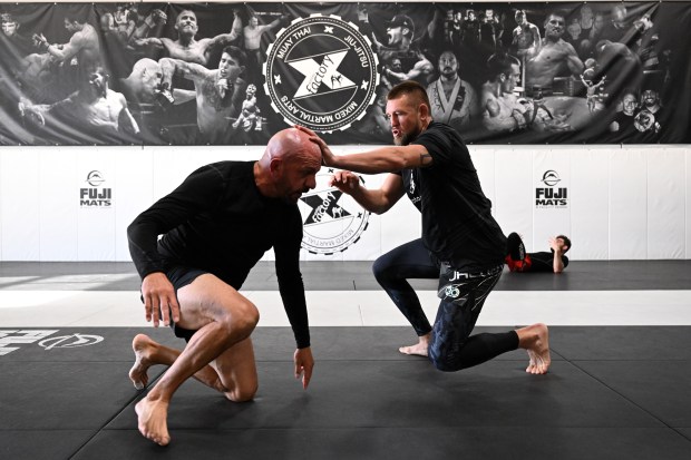 Dustin Jacoby, right, grapples with head coach Marc Montoya, on ground, during daily training at Factory X on December 6, 2023 in Englewood, Colorado. (Photo by Helen H. Richardson/The Denver Post)"