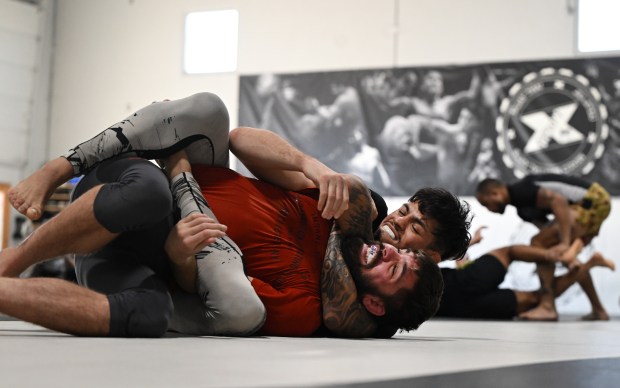 Brandon Royval, gets a choke-hold on Clay Matza as they grapple during a daily training session at Factory X on December 6, 2023 in Englewood, Colorado. Factory X is one of Colorado's top MMA gyms that features several of the state's top fighters that train together at the gym. (Photo by Helen H. Richardson/The Denver Post)"