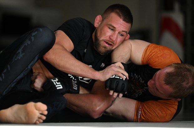 Dustin Jacoby, with face towards camera, grapples with AJ Fletcher, right, during a daily training session at Factory X on December 6, 2023 in Englewood, Colorado. (Photo by Helen H. Richardson/The Denver Post)"