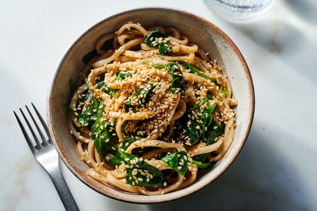Sesame-brown butter udon noodles. In this wafu pasta  a.k.a. Japanese-style pasta  Ali Slagle tosses udon with spinach, brown butter and soy sauce, with a sprinkling of toasted sesame seeds to finish. Food styled by Cyd Raftus McDowell. (Joe Lingeman, The New York Times)